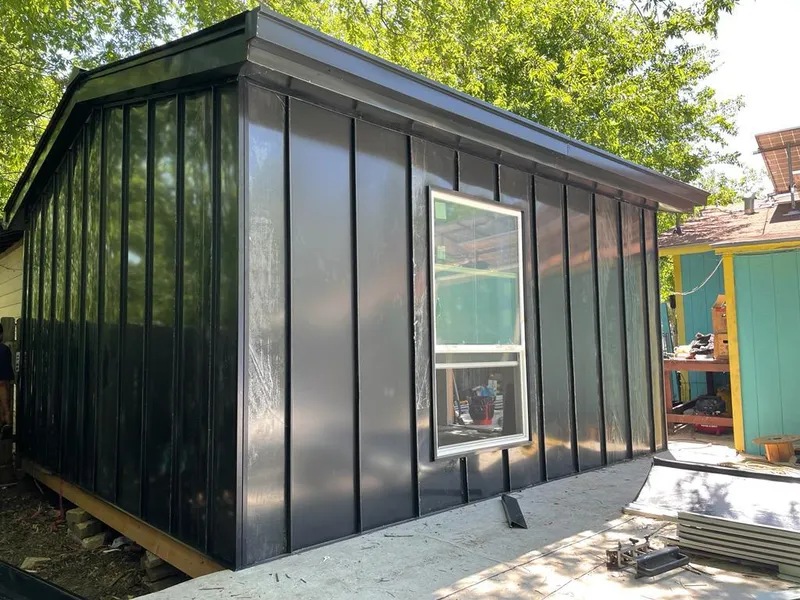 Black standing seam metal wall panels for Roof Inspection in Ottawa